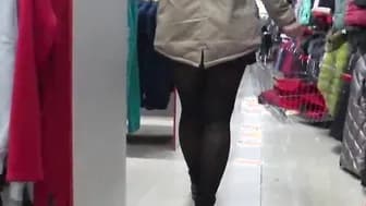 A concealed camera inside a fitting room spies on a bimbos with a crazy sexy booty and amazingly hot legs inside stockings.